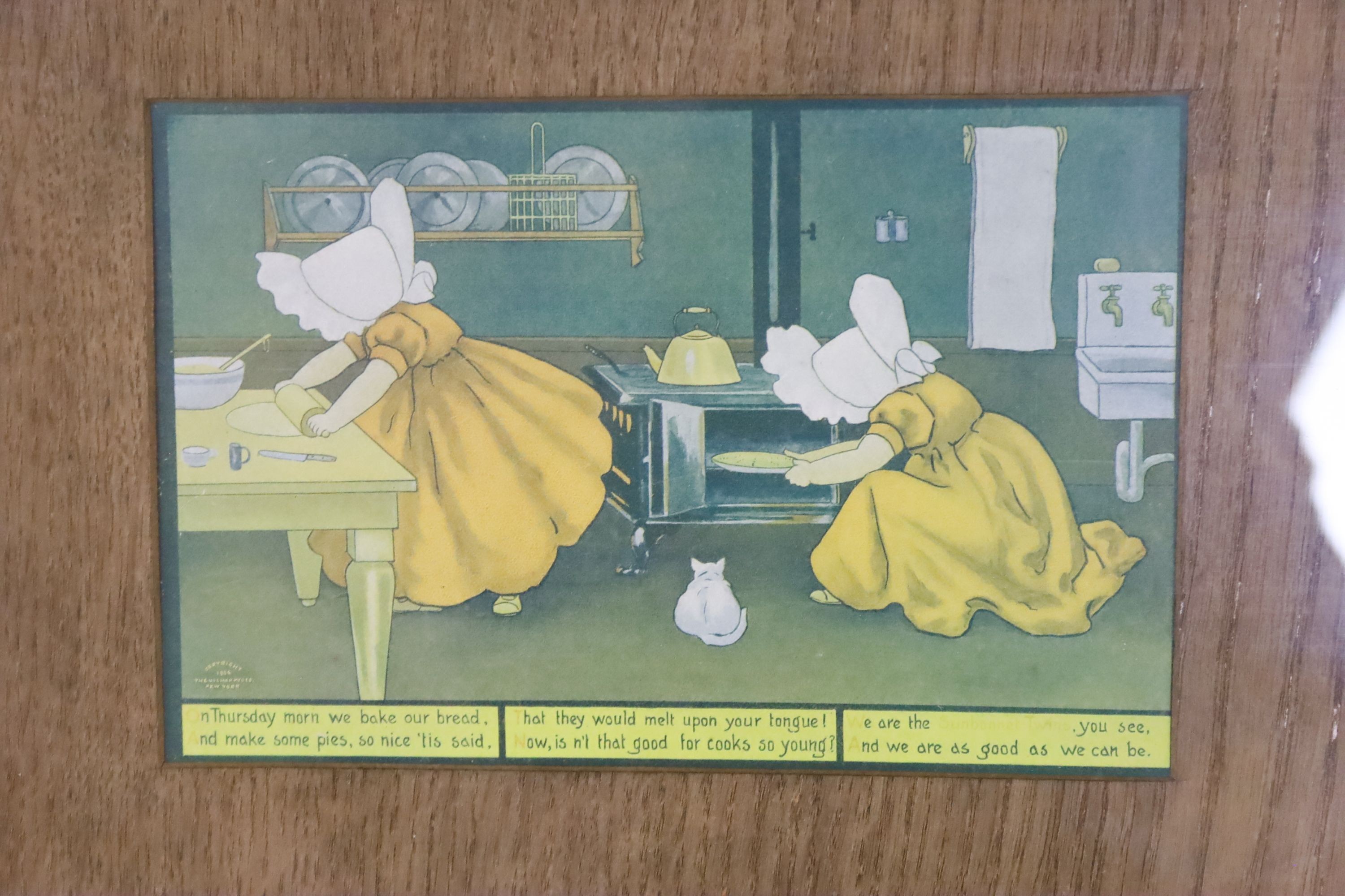 A set of seven sunbonnet twins oak framed 'days of the week' litho prints copyright 1905 by the Ullman mfg Co. New York